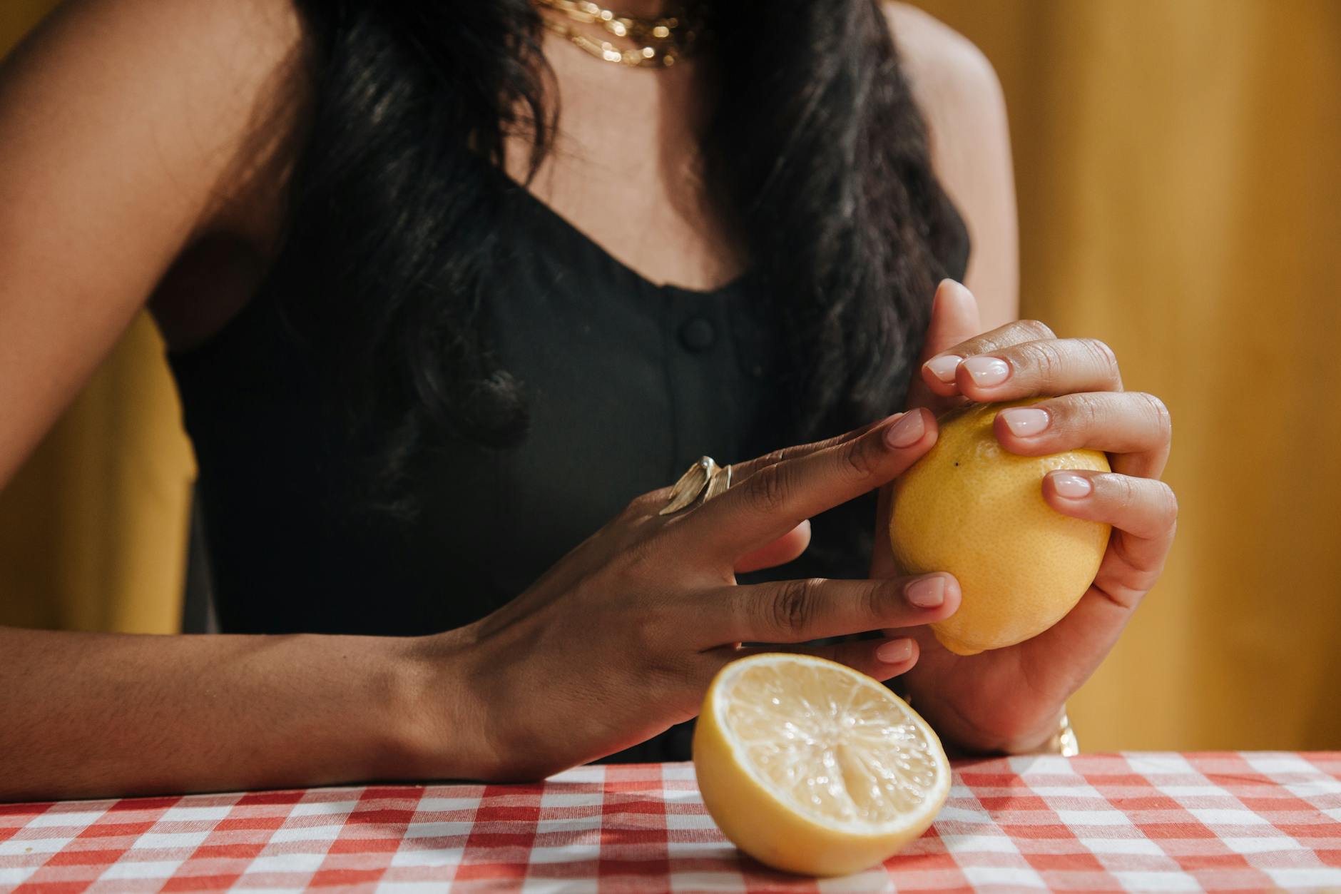 Hands holding pink and blue silicone vibrators on a pastel background, representing self-guided pleasure and intimacy tools.