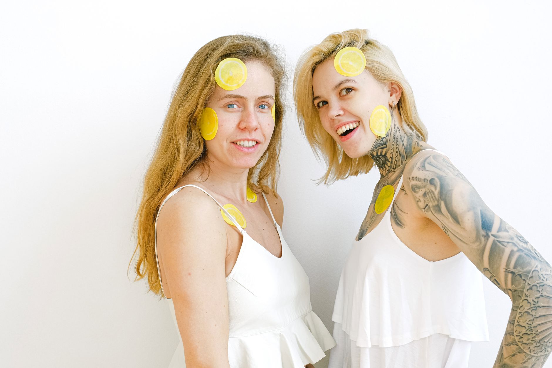 Two women laughing together, comfortable and at ease with one another