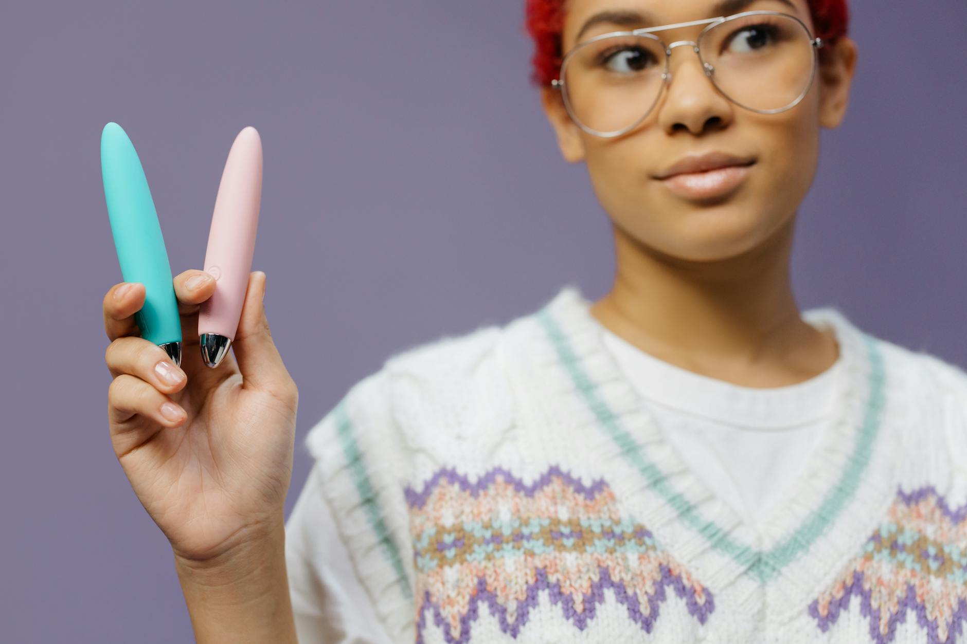 Young woman holding lemon vibrators and exploring sexual wellness in her 20s